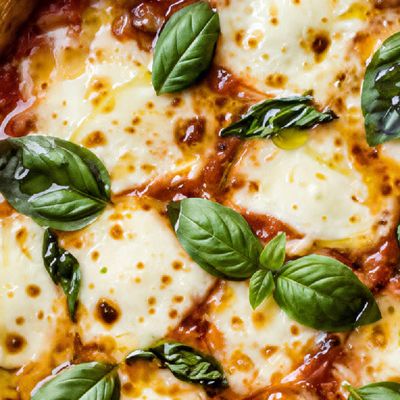 A close crop of the pizza crust at low strength, smooth and restrained