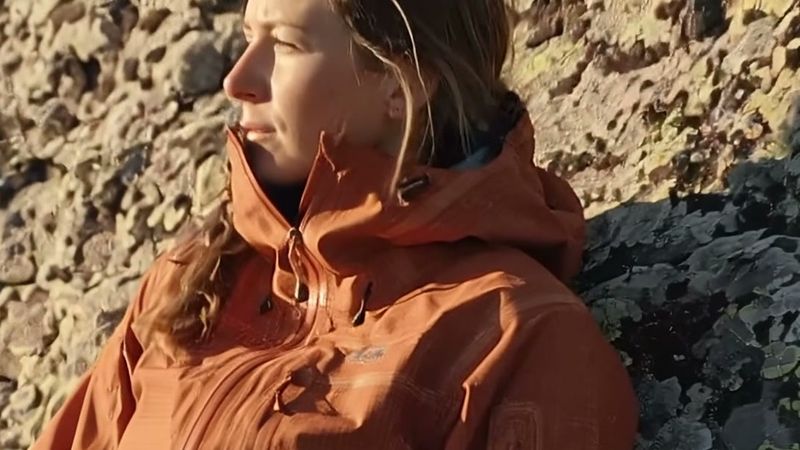 The same close crop from the 4K take, the hiker's face and the woven texture of her jacket collar clearly resolved