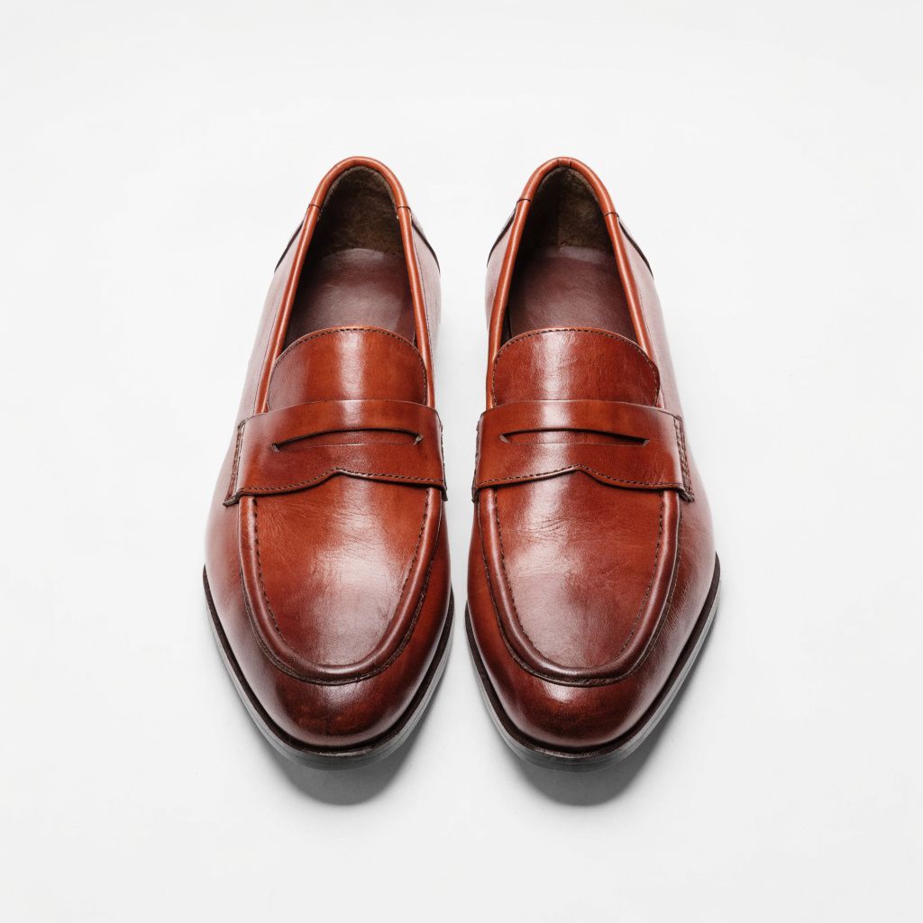 A pair of brown leather penny loafers
