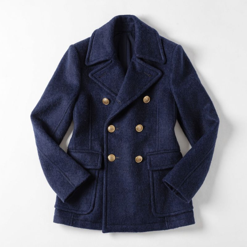 Flat-lay of the navy double-breasted peacoat
