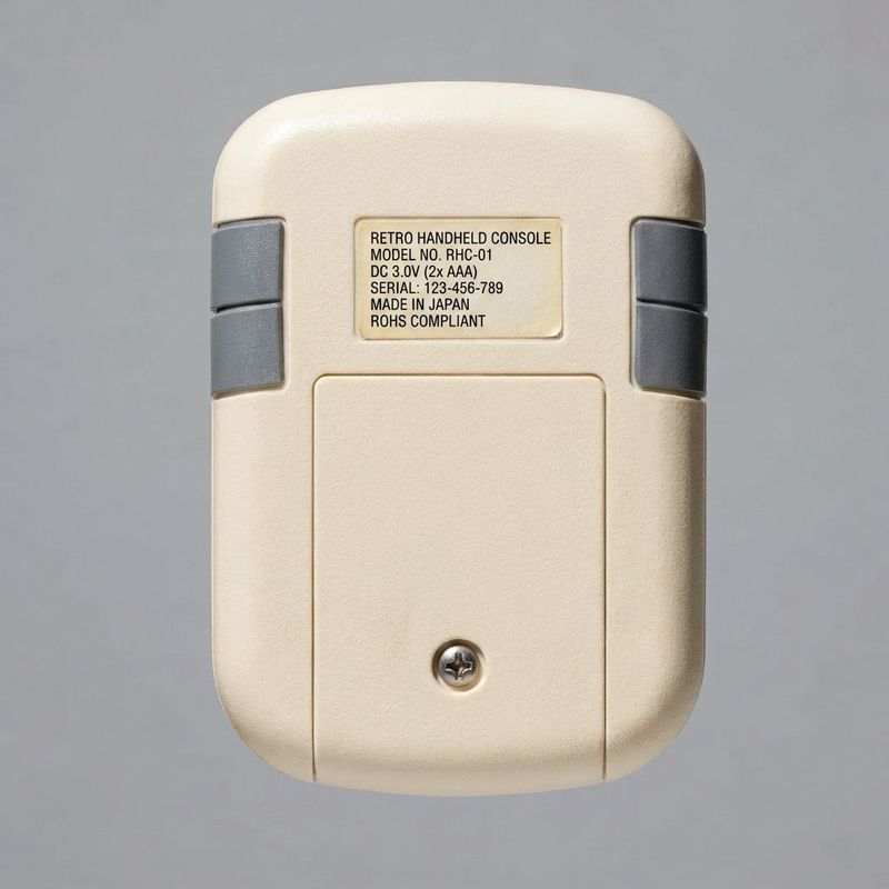 Retro handheld game console seen from the back