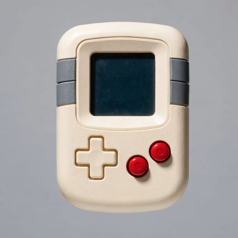 Retro handheld game console seen from the front