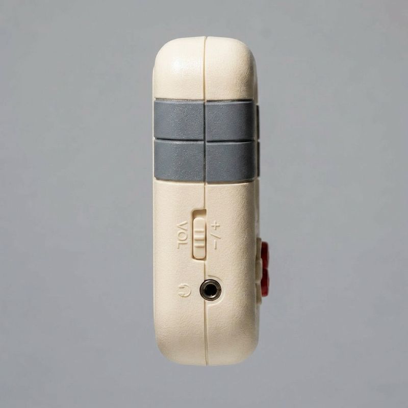 Retro handheld game console seen from the left side