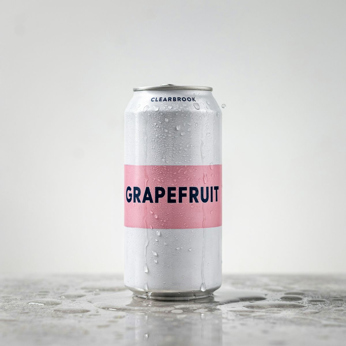 The same can with a soft pink band reading GRAPEFRUIT, the brand name and the condensation unchanged