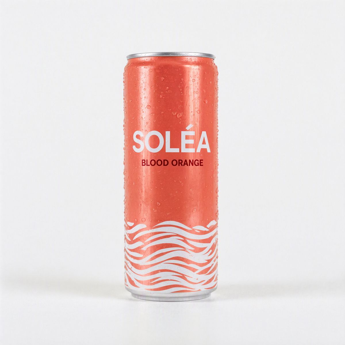 The same can in deep coral with SOLÉA in the same white type and the flavor now reading BLOOD ORANGE in dark red