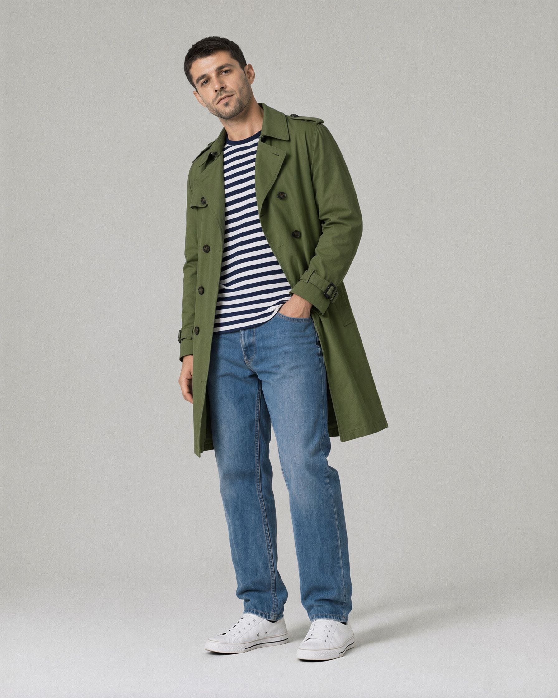 The same man in the same pose and studio, with the trench coat now olive green