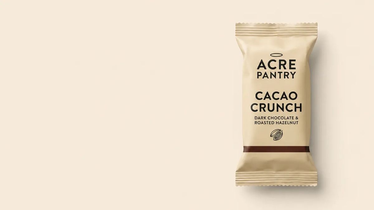 An outdoor poster composition with one Acre Pantry bar oversized as a single hero element on one side of the frame and the other half of the frame left as a flat solid copy zone ready for a tagline overlay