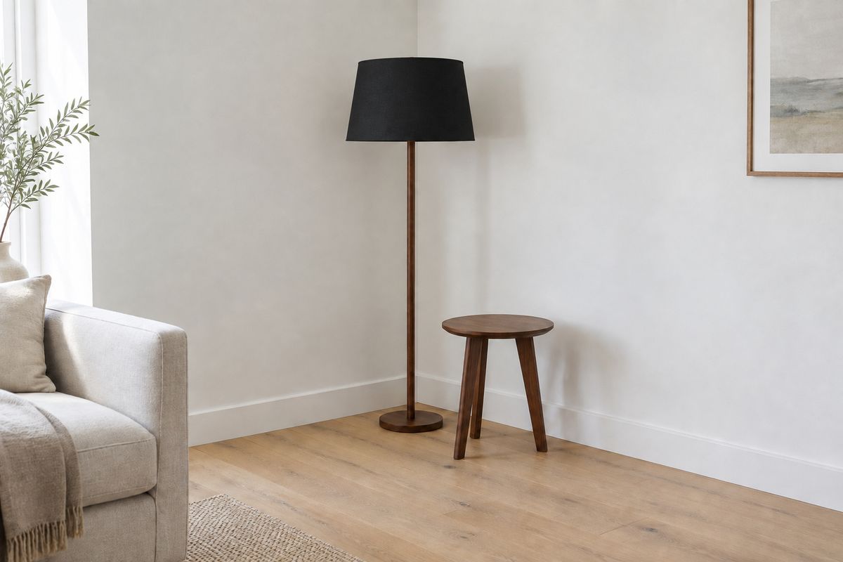 The same floor lamp in the same corner with its shade changed from natural linen to matte black
