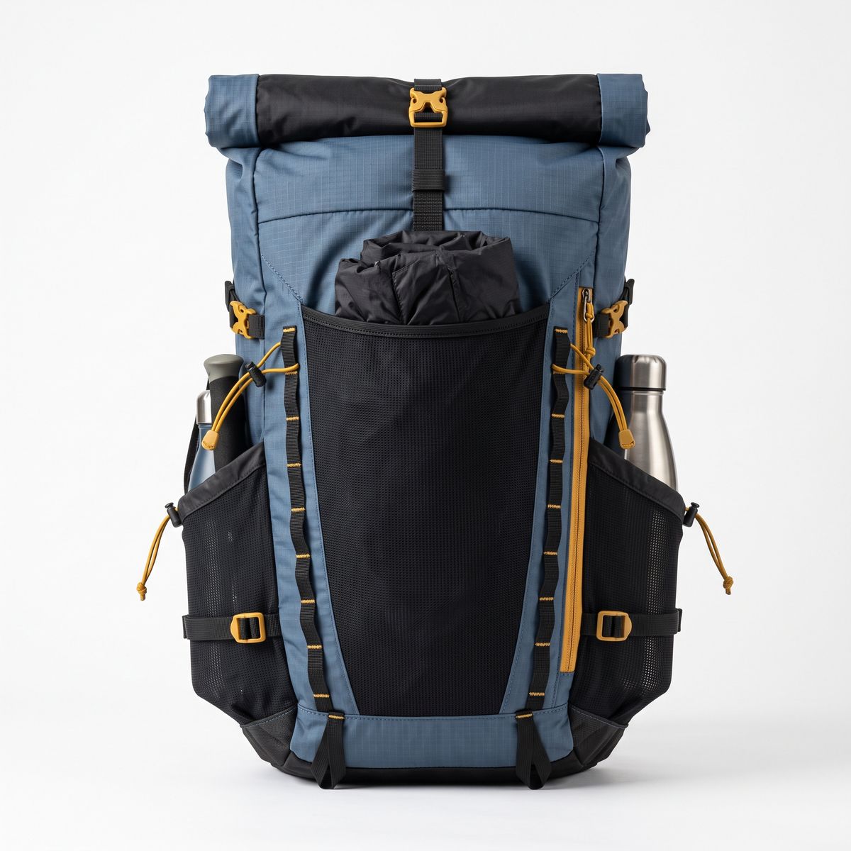 A slate blue hiking backpack from the outer face, with a black roll-top, front stretch pocket and mustard-yellow zipper pulls, on white