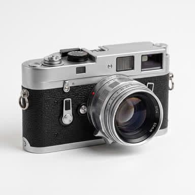 A very small, soft thumbnail of a retro film camera