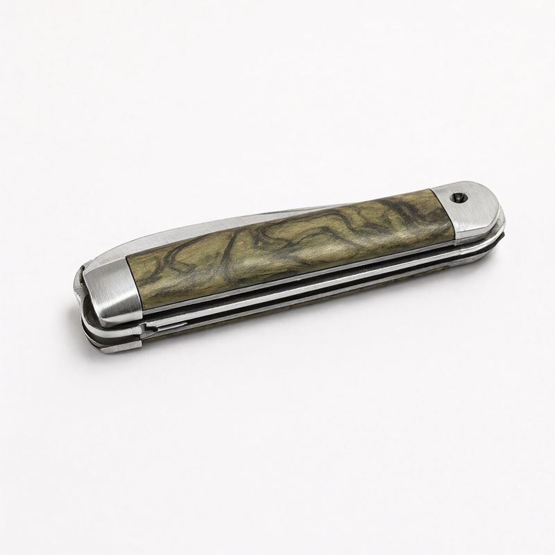 A closed folding pocket knife with a green marbled handle and steel bolsters on white