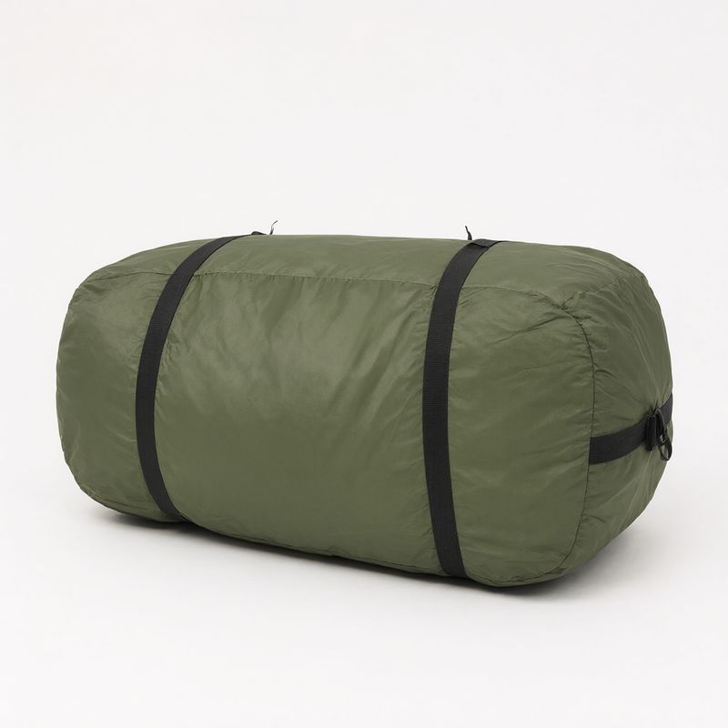An olive green cylindrical tent bag with two black straps on white